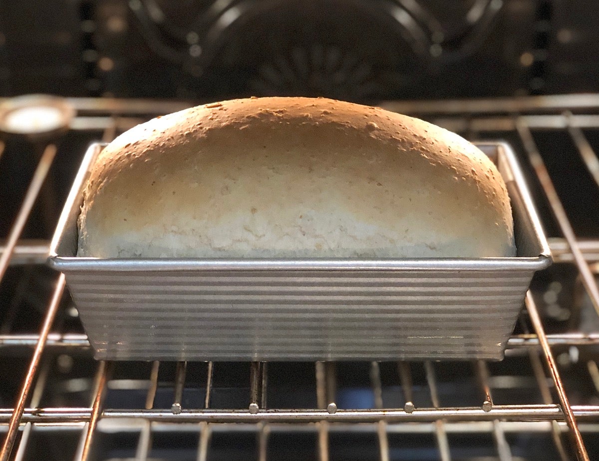 Oatmeal bread in the oven, golden brown and almost ready to take out